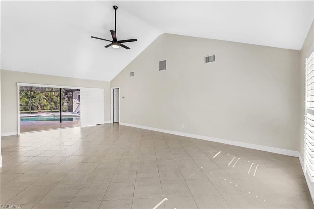 Living Room with Pocketing Sliders overlooking the Pool and Lanai