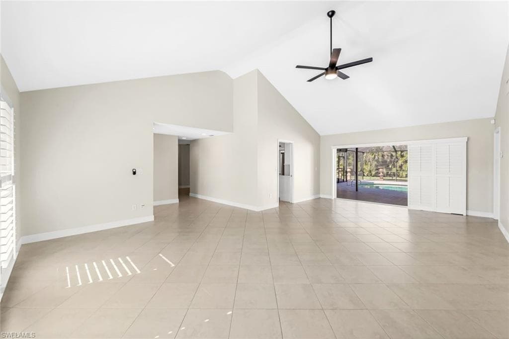 Living Room with Pocketing Sliders overlooking the Pool and Lanai