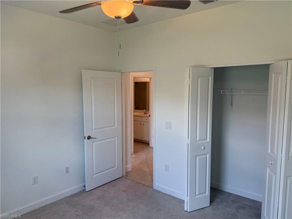 Neutral wall paint and carpeted flooring