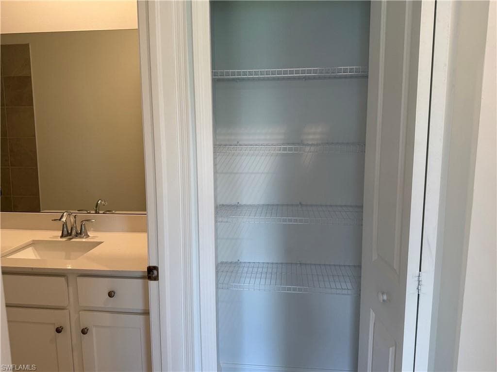Storage closet next to bathroom
