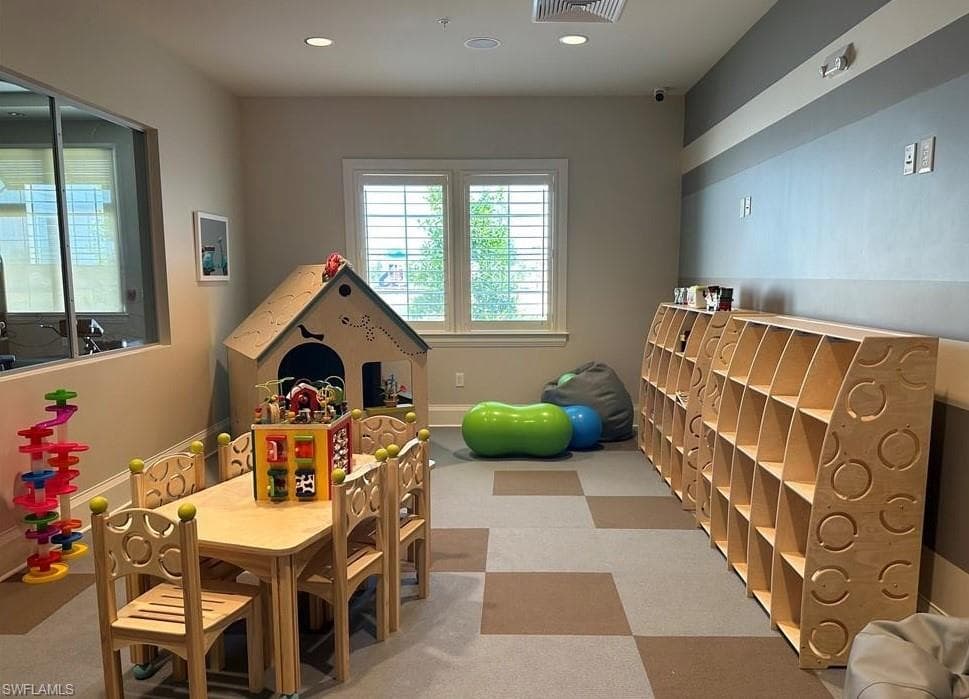 Playroom with recessed lighting and carpet flooring