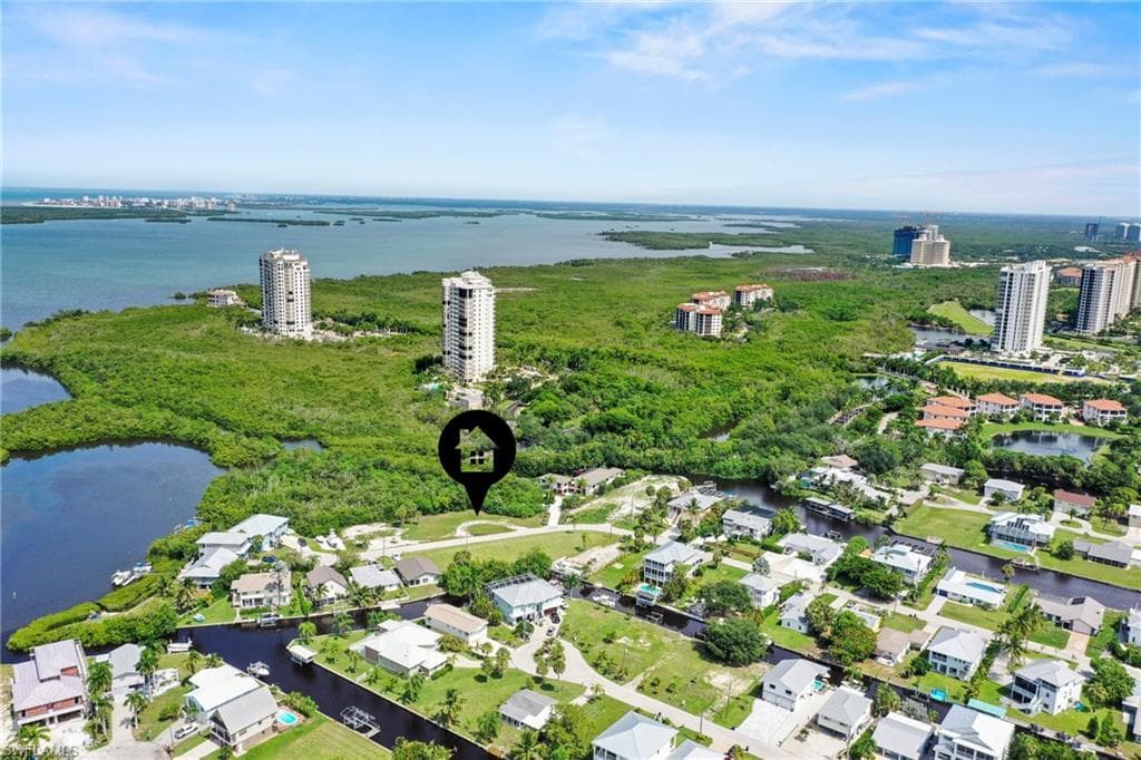 Aerial perspective showcasing a residential neighborhood with surrounding waterways