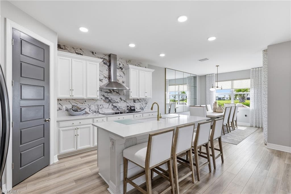 A chefs kitchen with designer finishes and an oversized island