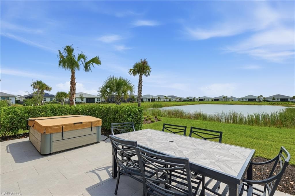 Tiled outdoor waterfront patio with peaceful lake views