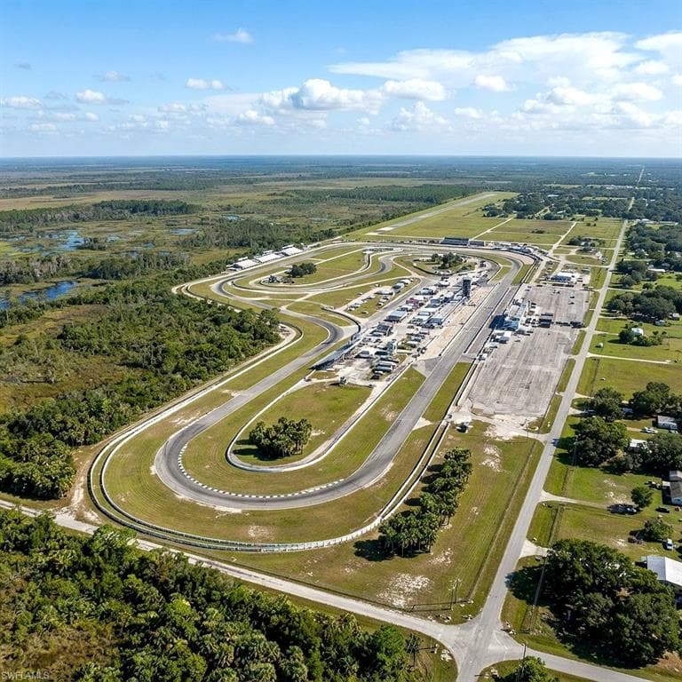 Extensive motorsports complex featuring multiple race tracks, an airstrip, and a large paved paddock area