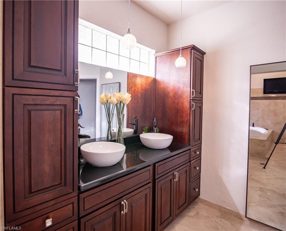 Dual vessel sinks with wall-mounted faucets