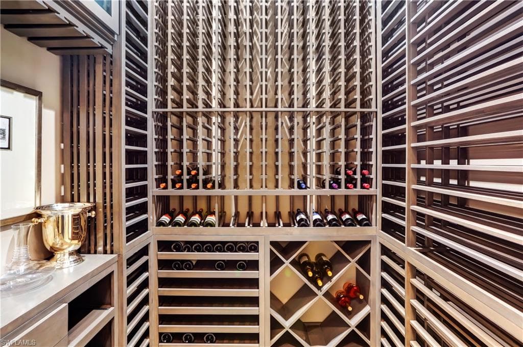 Custom wine cellar with extensive wood bottle racking, diamond-bin storage, and display shelving