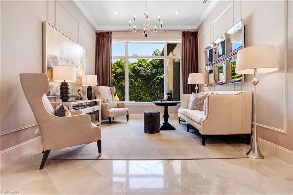 Spacious sitting area featuring large format tile flooring and a prominent window