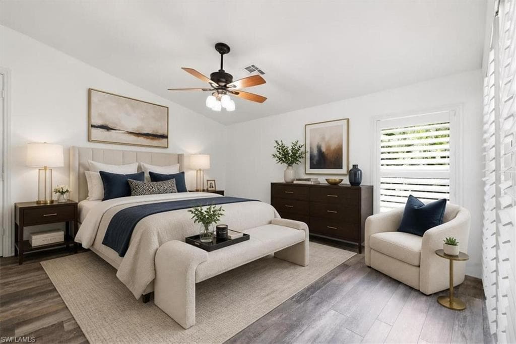 Vaulted ceiling with a ceiling fan, wood-finish flooring, white plantation shutters, and recessed lighting