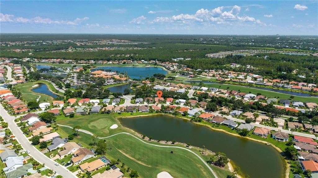 Aerial perspective showcasing a residential community with numerous homes