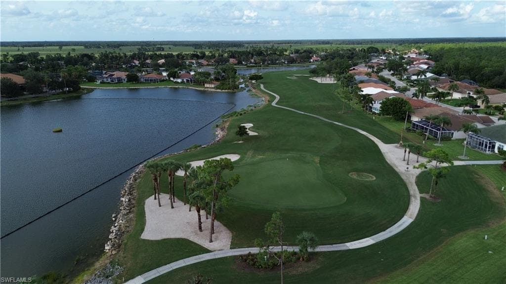 Expansive golf course green with manicured turf and sand traps