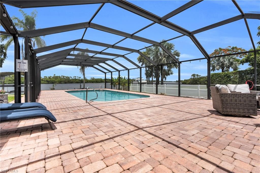 The Pool Area Come With A Paver Pool Deck And A Screened Lanai That Contains A Picture Window View At The End For A Maximum View Of The Amazing Caloosahatchee River!