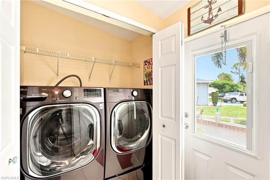 Dedicated laundry area featuring wire shelving