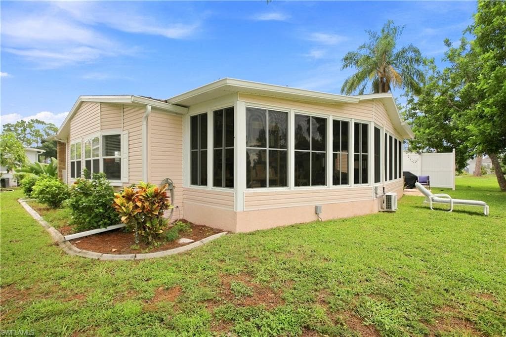 Expansive sunroom featuring multiple large windows
