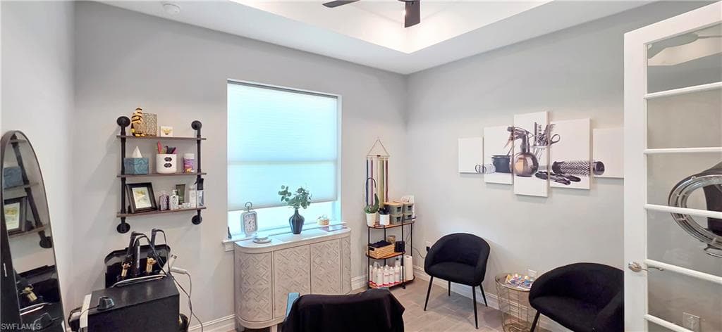 Spacious interior room featuring French doors with glass panels, wood-finish flooring, recessed lighting, and a contemporary ceiling fixture