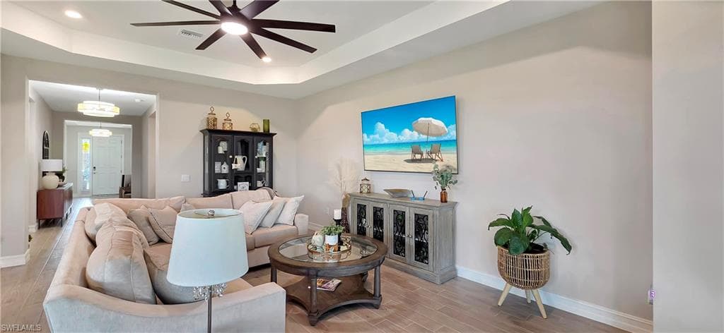 Tray ceiling with a ceiling fan and recessed lighting