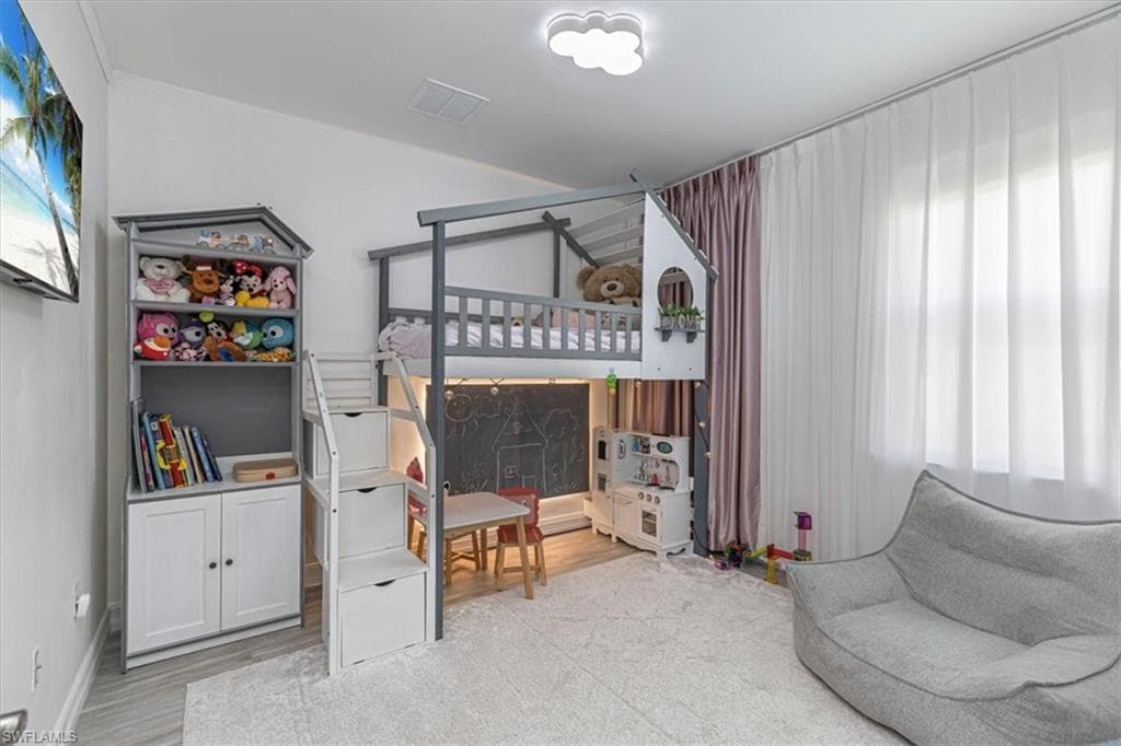 Bedroom with light wood-style floors