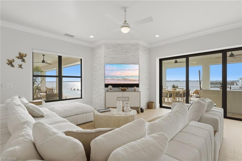 Expansive river views unfold from every vantage point, creating a breathtaking backdrop throughout the home.