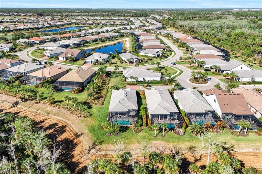 Aerial overview showcasing a residential neighborhood with single-story homes