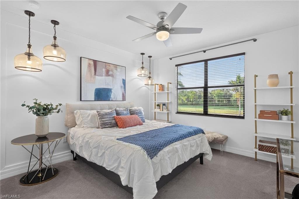 2nd bedroom. Custom built-in shelves, walk-in closet, and recessed lighting, ceiling fan with integrated light, and dual pendant lights provide ample illumination