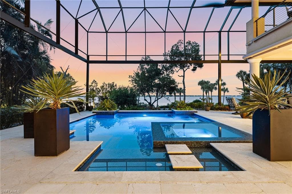 After a day on the links, retreat to your private, custom-designed pool and spa and immerse yourself in the breathtaking beauty of Southwest Florida sunsets and abundant wildlife. Dramatic 35-foot picture-window screens creates an uninterrupted connection to the exquisitely landscaped beach and river beyond, allowing you to savor the views from the comfort of your private oasis. A truly exceptional private compound, designed for effortless relaxation, complete privacy, and refined waterfront living.