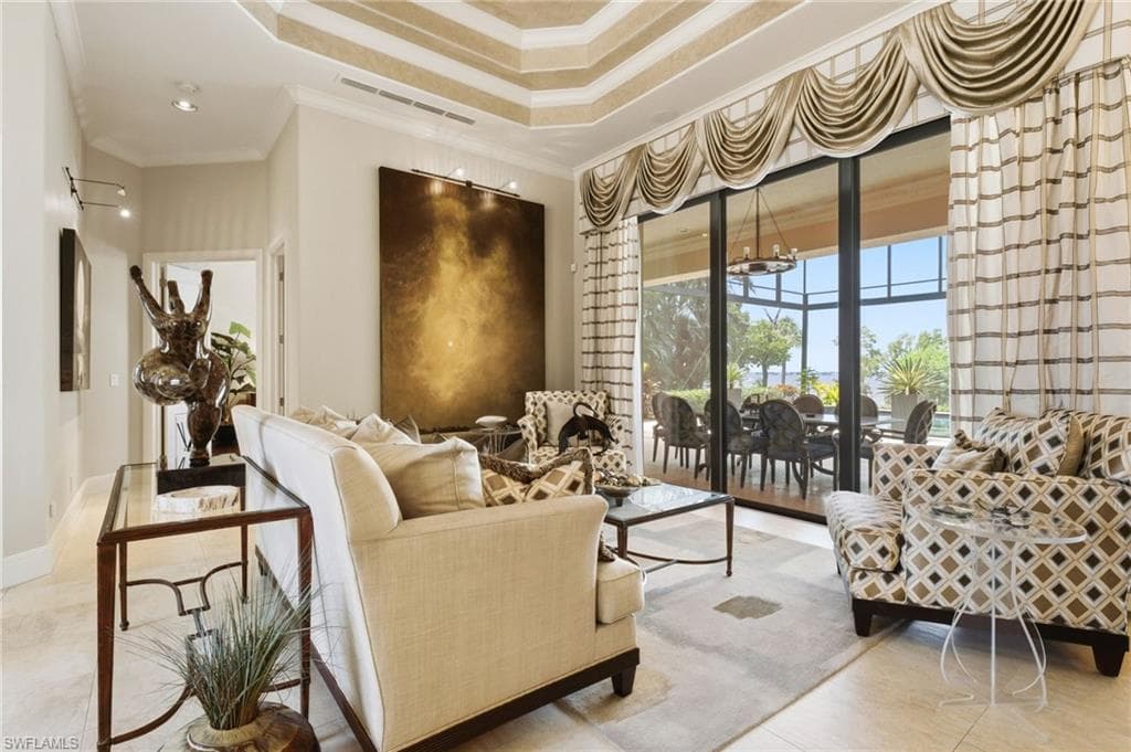 As you enter, you are immediately captivated by breathtaking river views, while dramatic double-tray ceilings welcome you into this magnificent custom-designed palace, setting the stage for an extraordinary living experience.