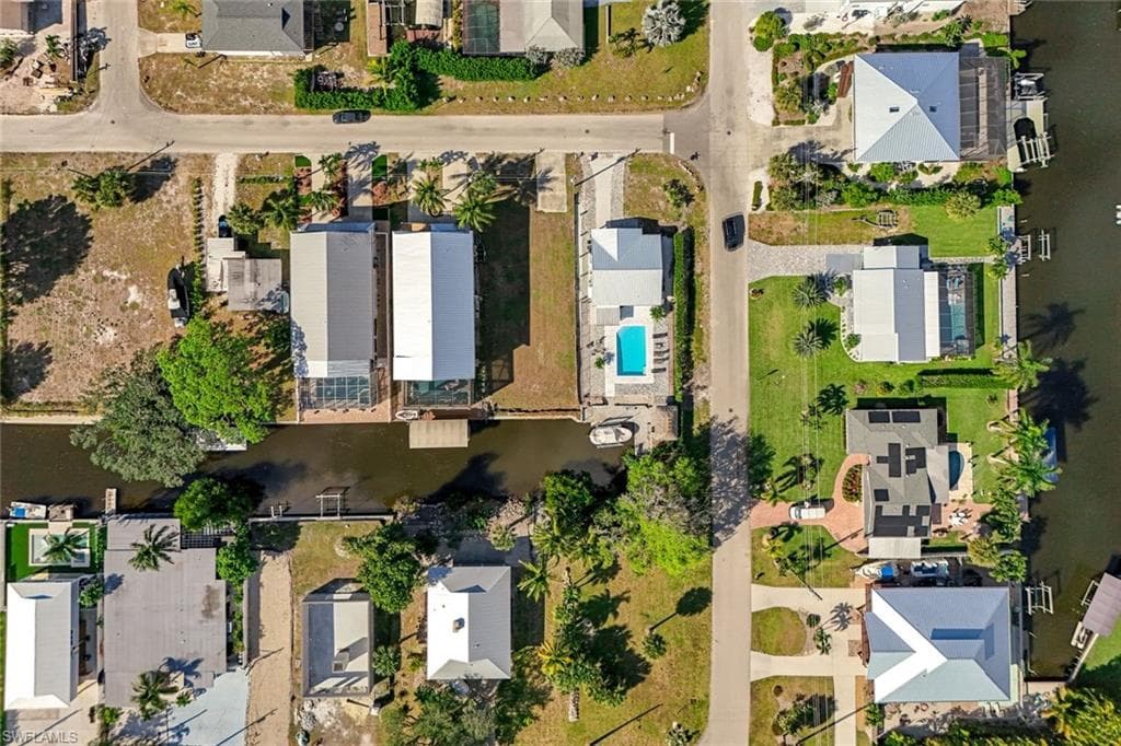 View of property location with nearby suburban area and a large body of water