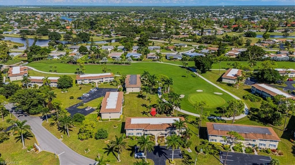 View of property location featuring a nearby body of water and nearby suburban area