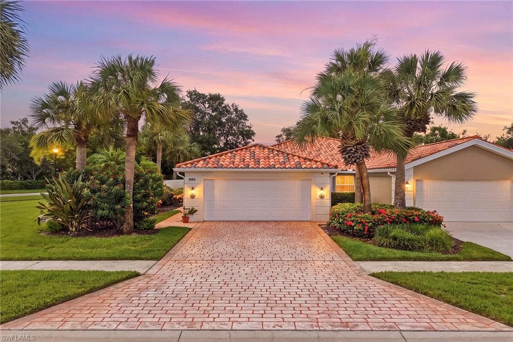 Corner unit with two car garage and plenty of parking space
