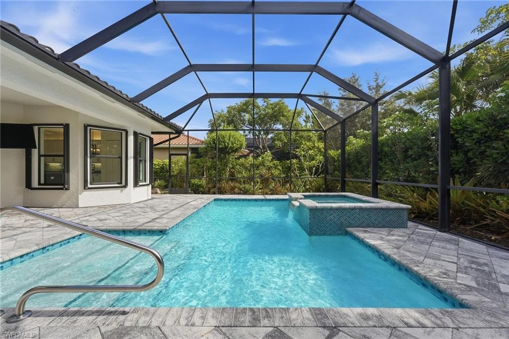 Gas heated pool with spa, sun shelf, bubblers.