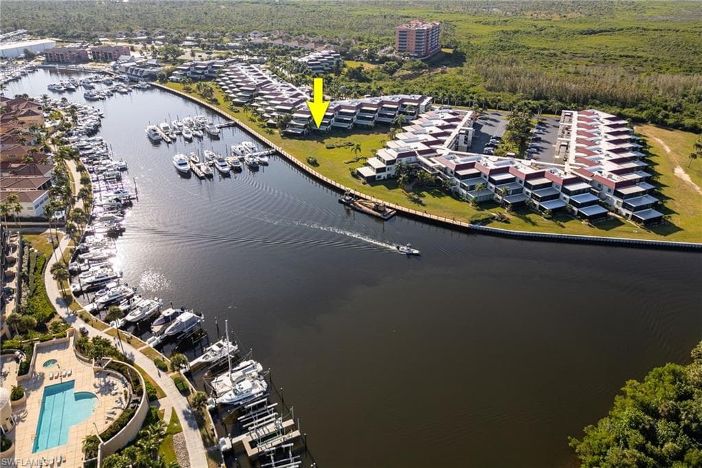 Aerial perspective of a waterfront community featuring canal access