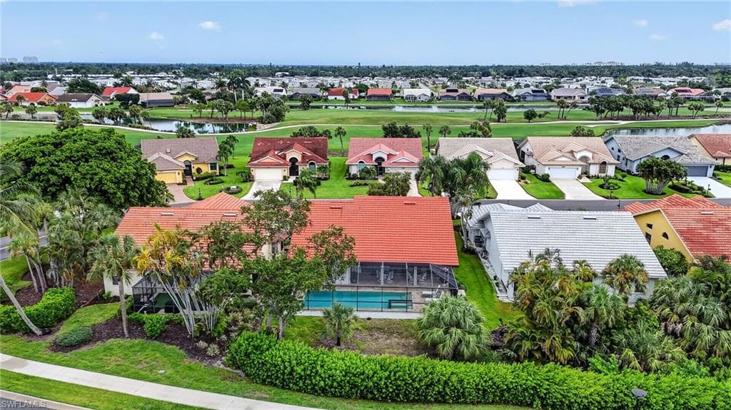 Aerial perspective of a residential community featuring diverse architectural styles and lush landscaping
