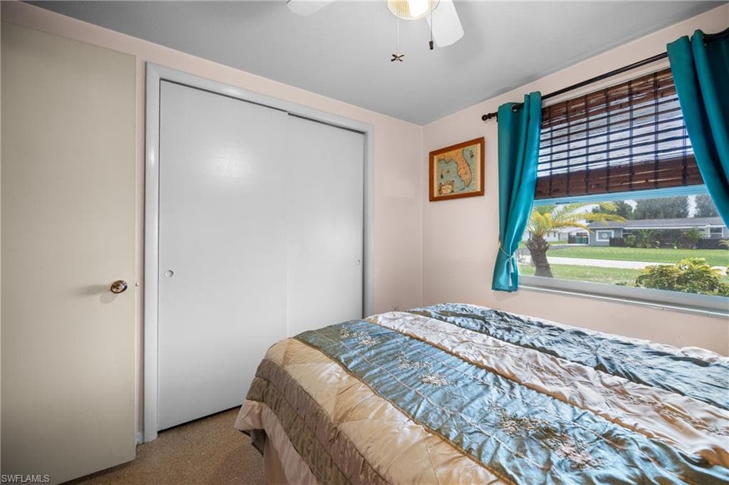 Window with horizontal blinds and drapery