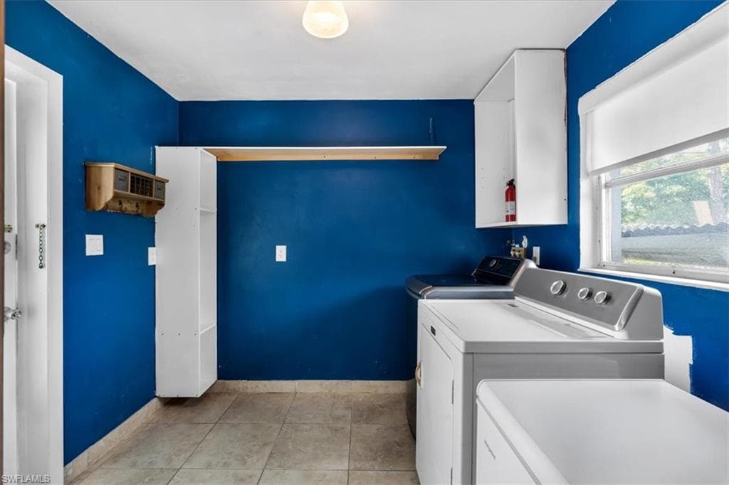 Tiled flooring with an exterior window and built-in shelving