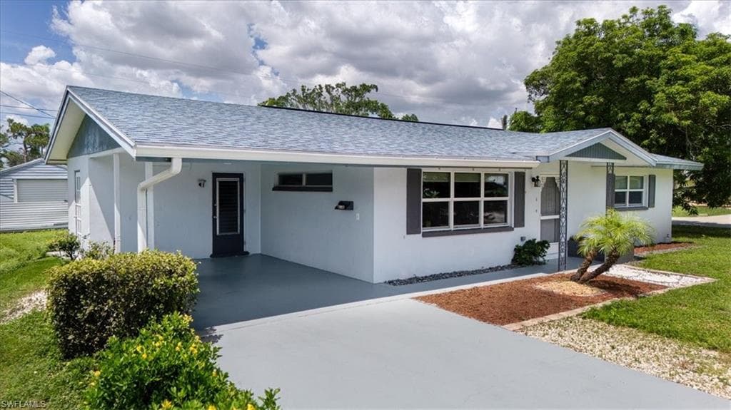Light blue exterior with gray roof shingles