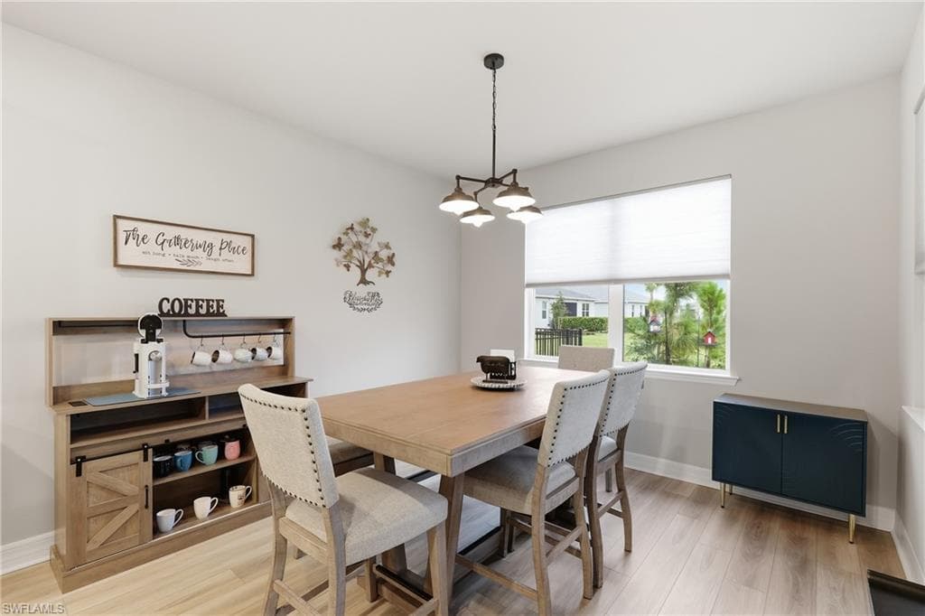 Spacious eat in kitchen overlooking the backyard and peaceful lake filled with natural light