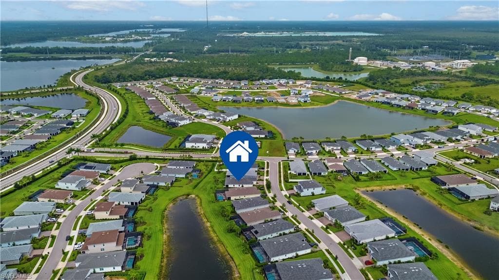 Aerial perspective showcasing a residential community with numerous homes
