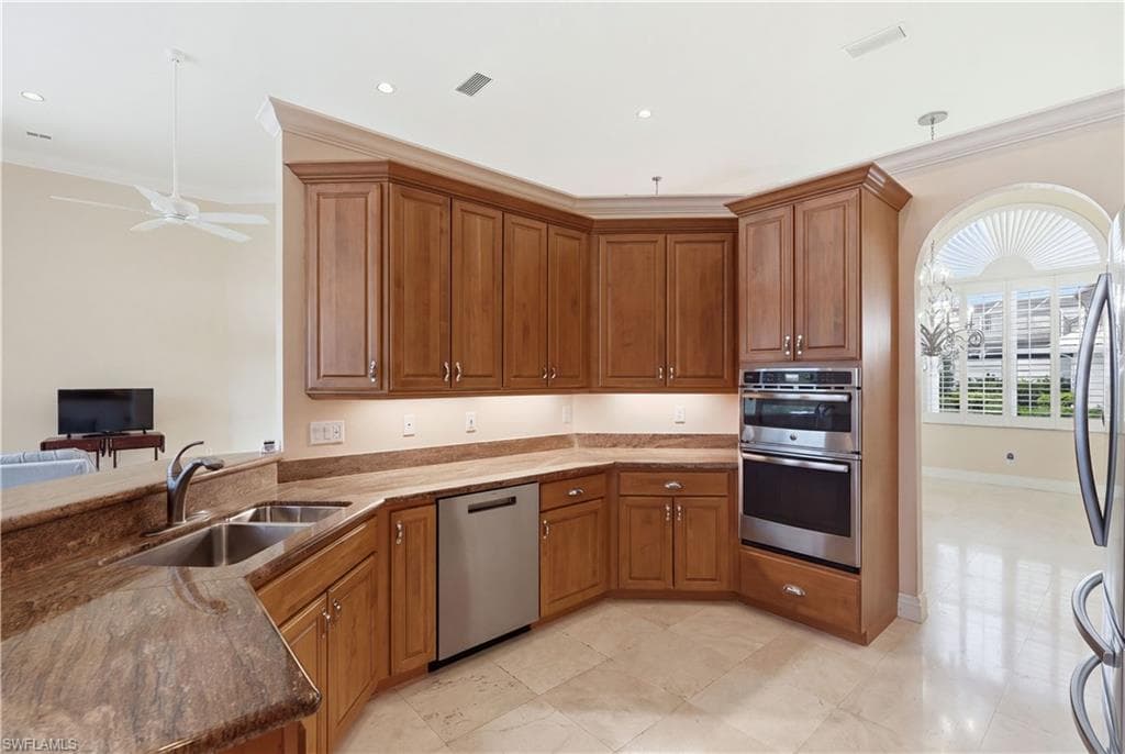 Designed for effortless entertaining, this light-filled kitchen connects naturally with the living room and formal dining space.