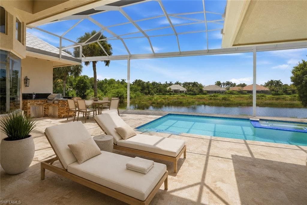 An outdoor dining area, and a fully equipped summer kitchen create an exceptional environment for year-round entertaining.