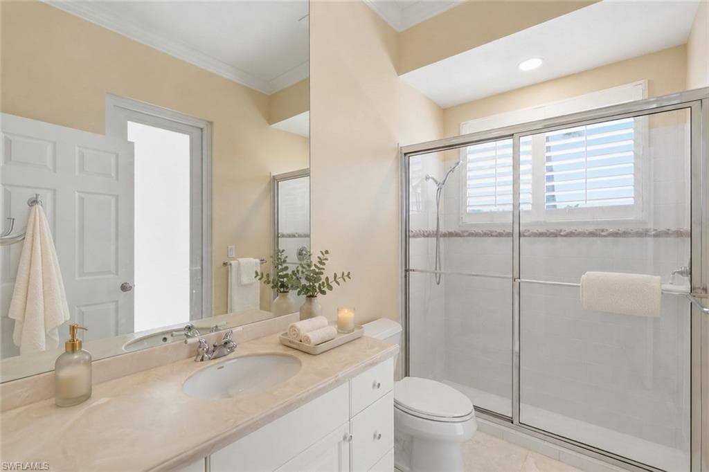 Bathroom serves guest in-law suite, also with pool access.