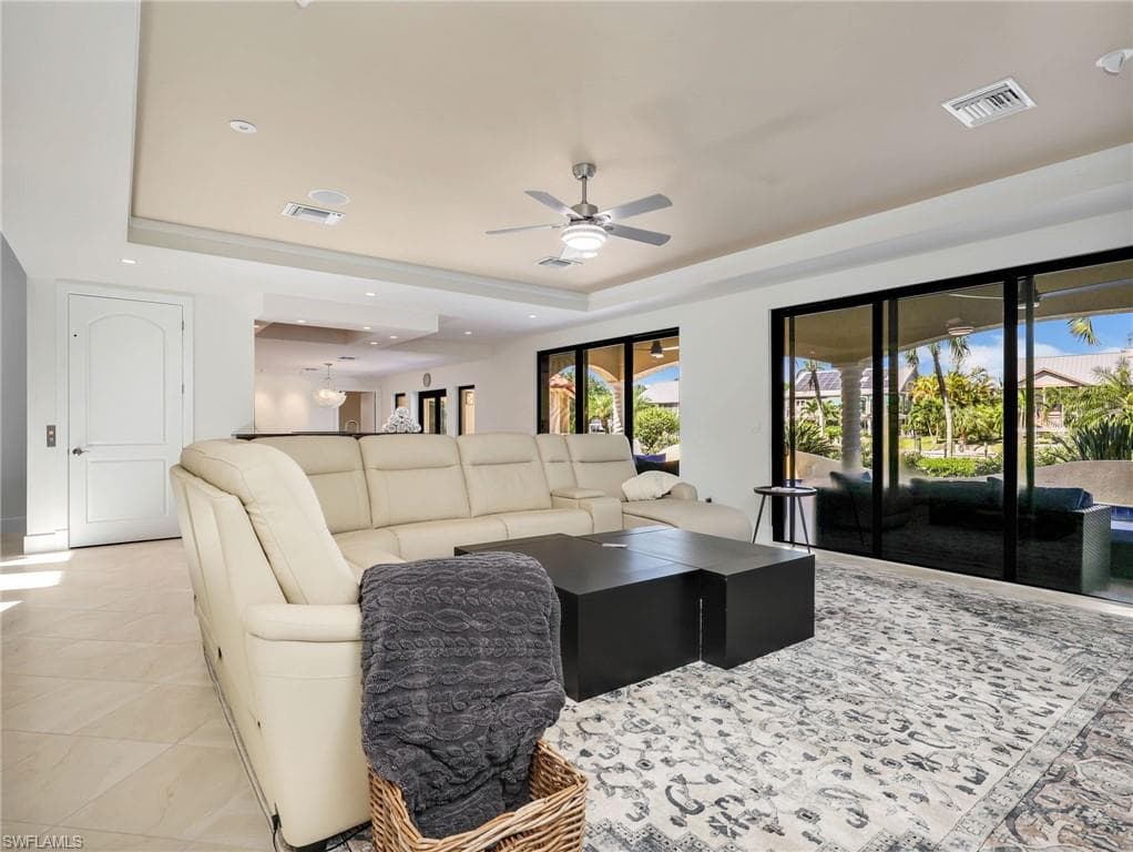 Tray ceiling with recessed lighting and a ceiling fan