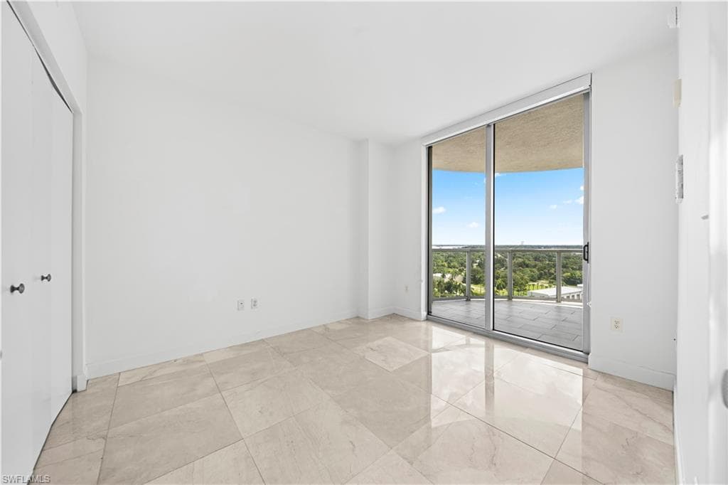 2nd bedroom w/Marble Tile Floors & Sliders to Tiled Lanai