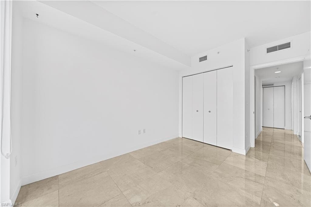 3rd bedroom w/Marble Tiled Floors and Sliders to Tiled Lanai