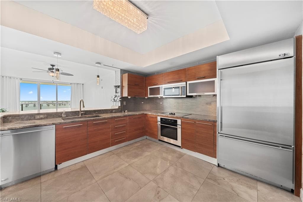Upgraded Lighting & Tiled Backsplash