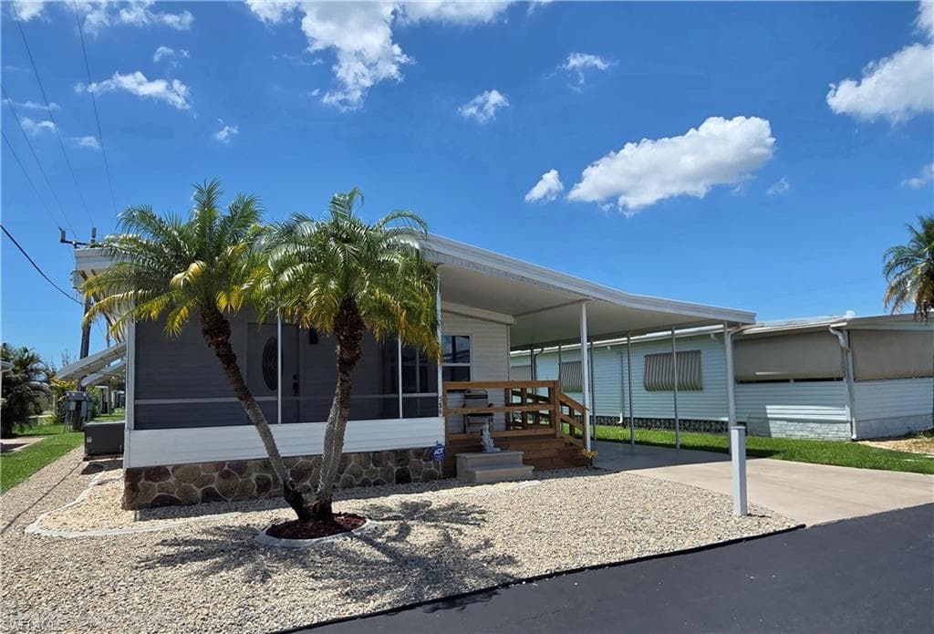 Concrete curbing and rock landscaping makes for a tidy yard.