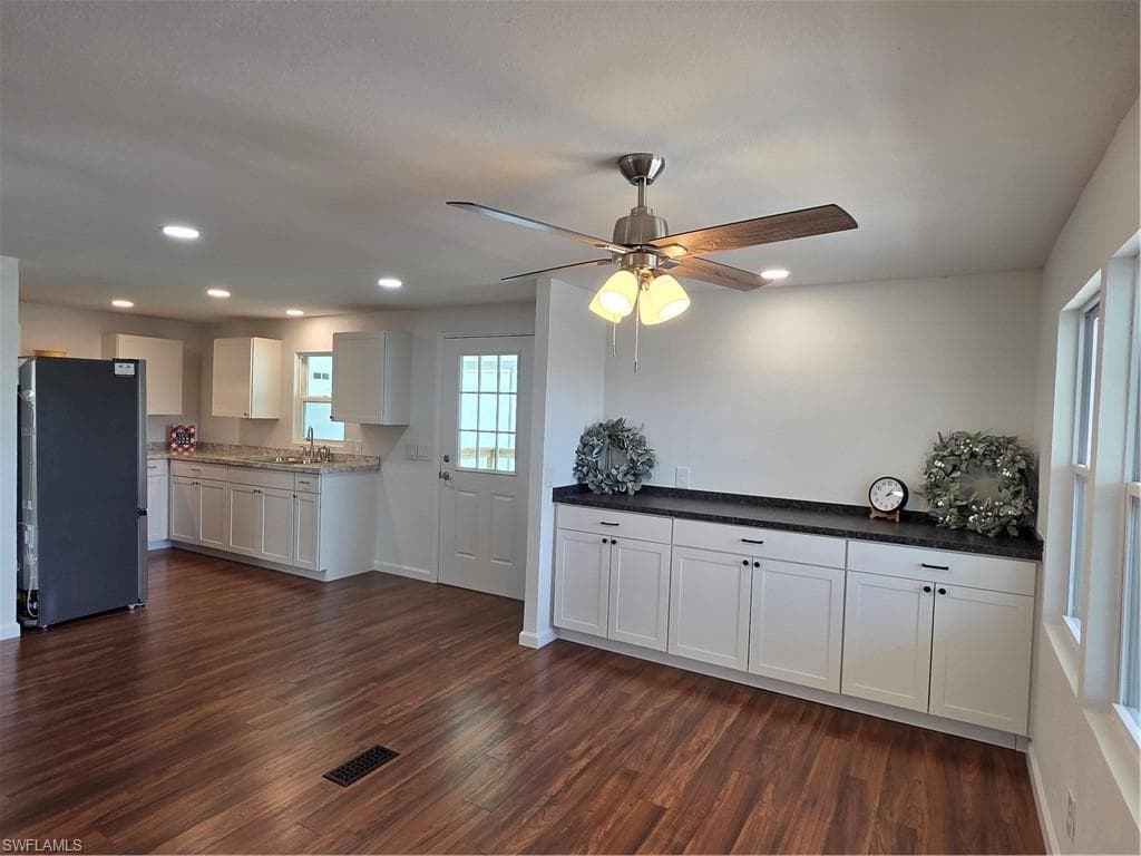 Dining Room off the Kitchen has built-in cabinets for extra storage.