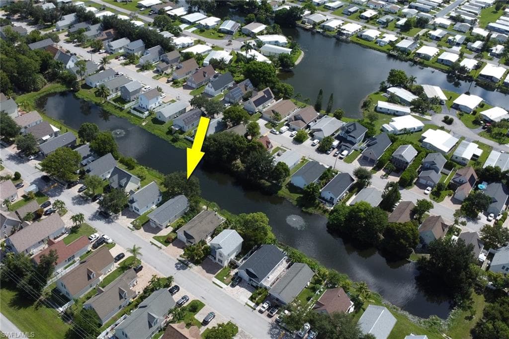 Waterfront property with mature trees and paved street access