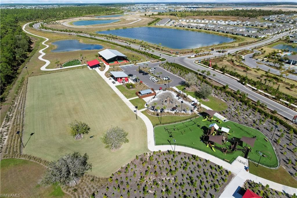 Expansive green spaces and multiple recreational areas, including a playground and open field