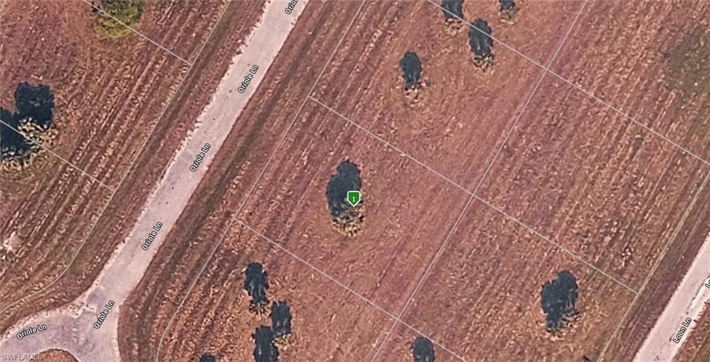 Aerial view. Showing the property with surrounding land parcels and access roads