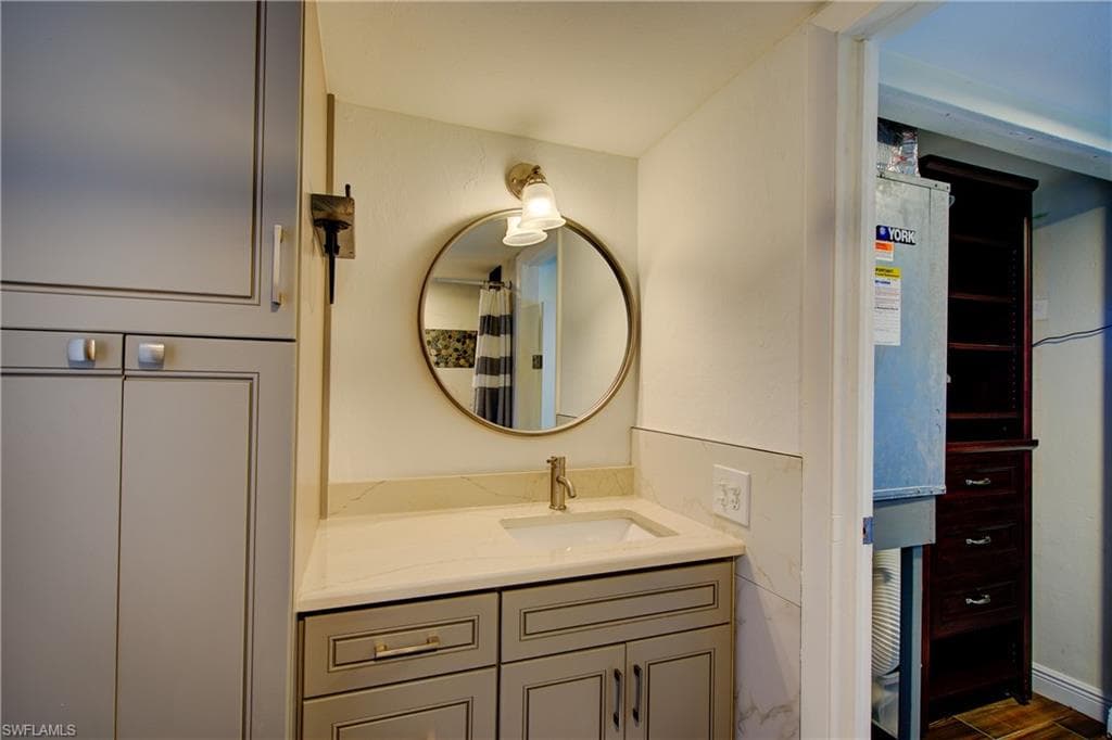 You get lots of cabinet storage space in this Master Bath